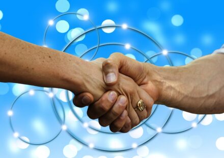 business people shaking hands trust