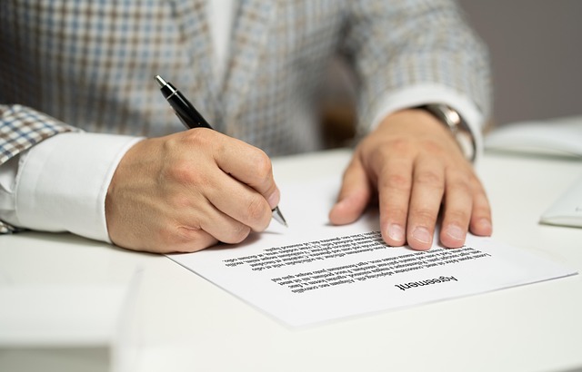 Close-up of a business contract with key terms highlighted