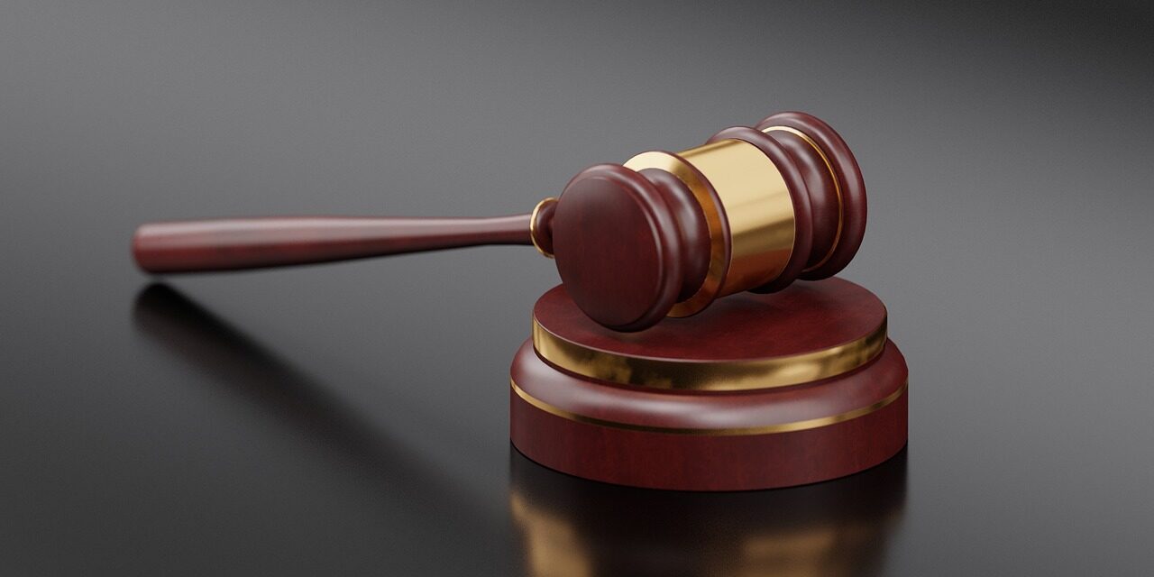 court gavel striking block