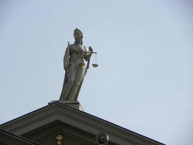 Scales of justice on a desk with legal documents (florida immigration law injunction)