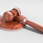 scales of justice with person making choice