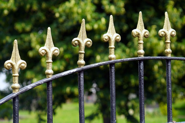 Wrought iron fence post with rust spot